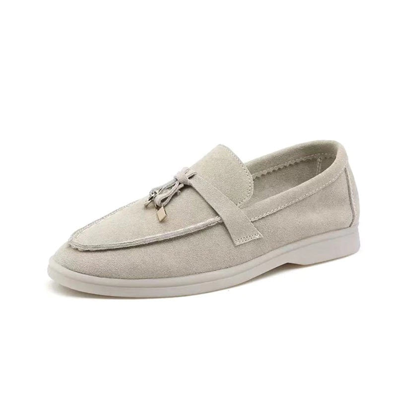 Women's flat slip-on loafers with rounded moc toe and metal trim