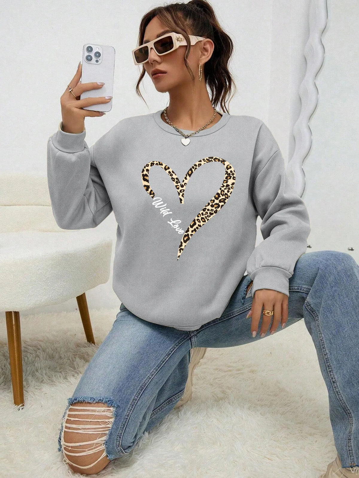Women's sweatshirt with leopard-print heart graphic, crew neckline and long sleeves