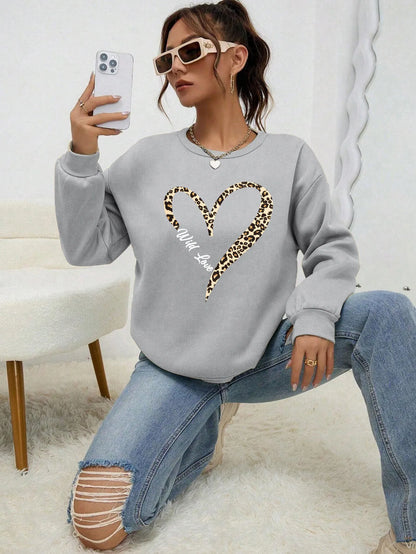 Women's sweatshirt with leopard-print heart graphic, crew neckline and long sleeves