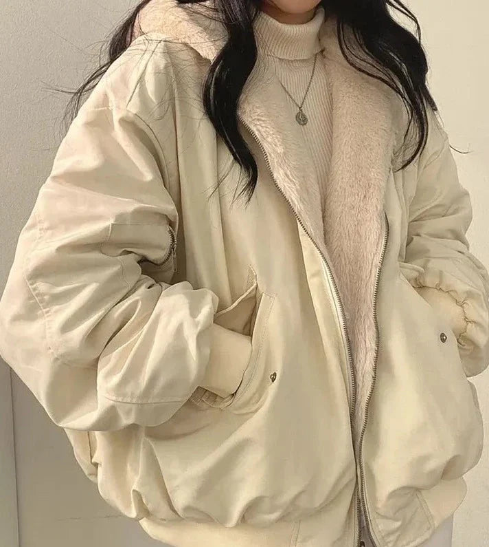 Women's lined bomber-style winter jacket with plush collar and zip front