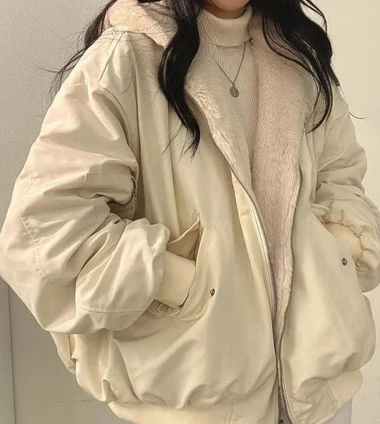 Women's lined bomber-style winter jacket with plush collar and zip front