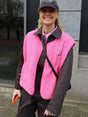 Women's textured sherpa vest with snap buttons and contrast edging
