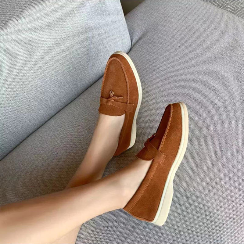 Women's flat slip-on loafers with rounded moc toe and metal trim