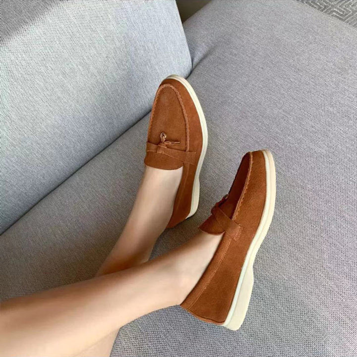 Women's flat slip-on loafers with rounded moc toe and metal trim