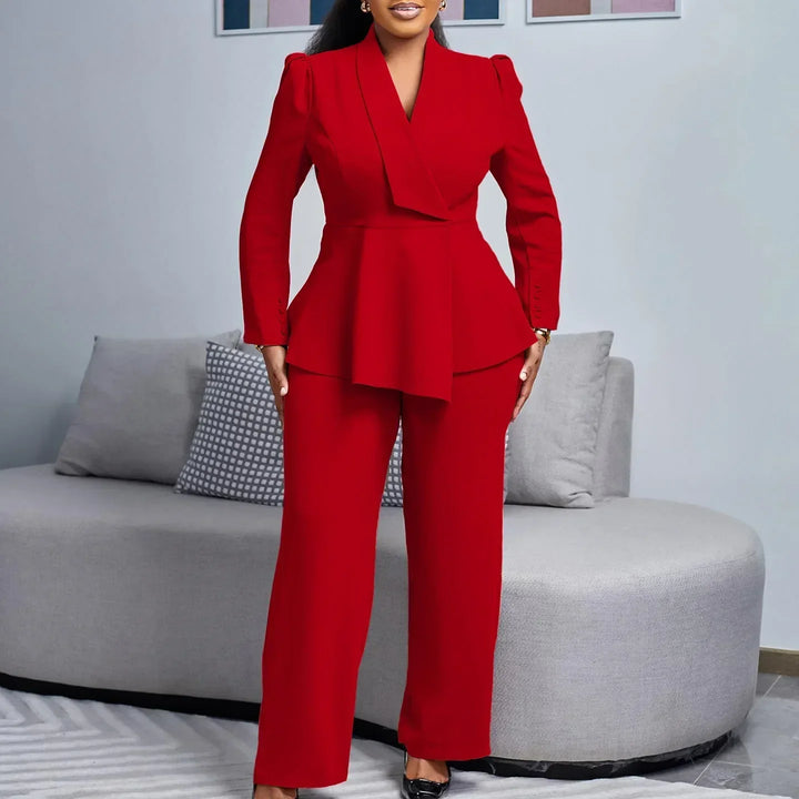 Woman wearing a beige peplum blazer suit set with wide-leg trousers