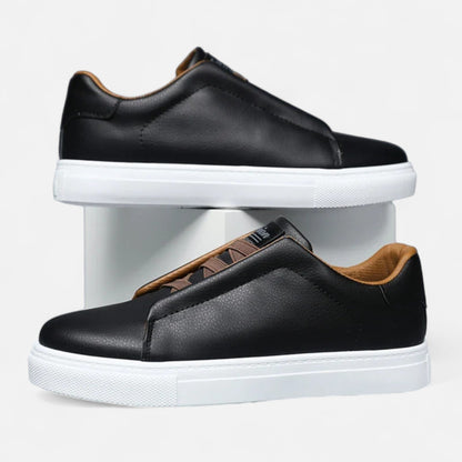 Men's low-top slip-on sneakers with stitched panels and flat white soles