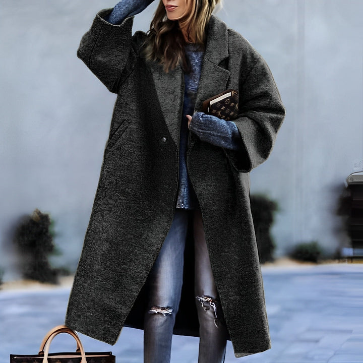 Women's long lapel coat with single button and front pockets