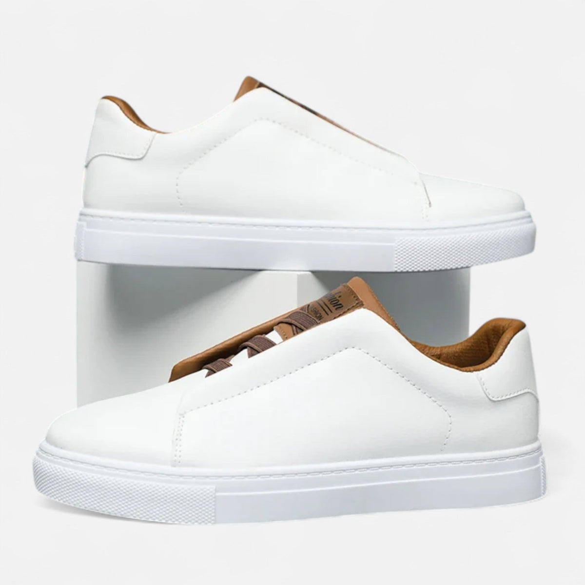 Men's low-top slip-on sneakers with stitched panels and flat white soles
