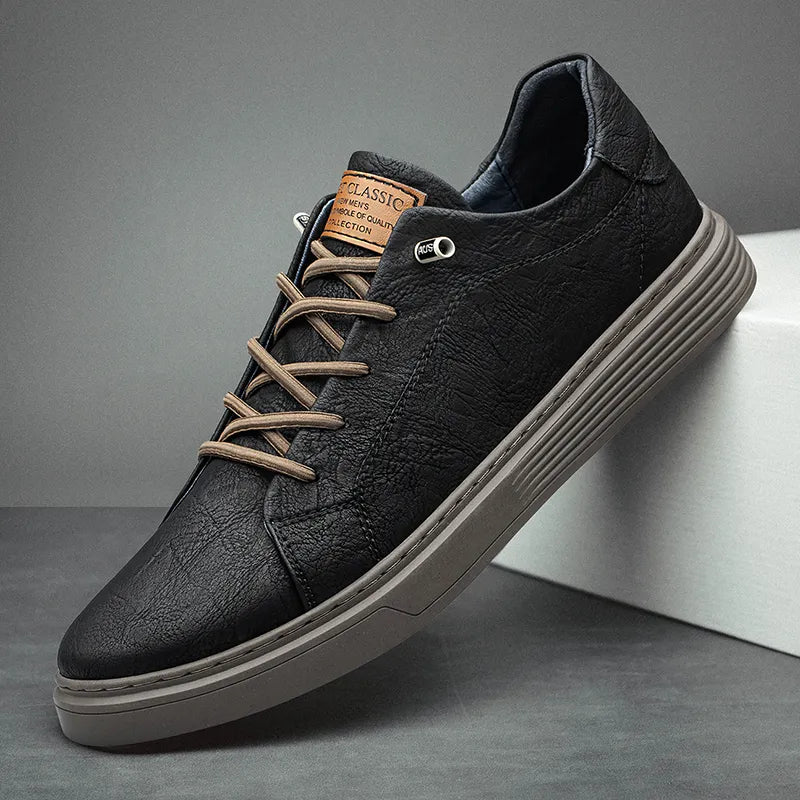 Men's low-top lace-up sneakers with stitched panels and a layered flat sole