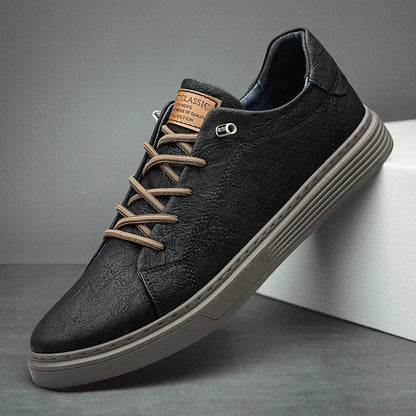 Men's low-top lace-up sneakers with stitched panels and a layered flat sole