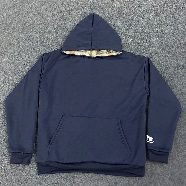 Loose hooded sweatshirt with plaid lining and kangaroo pocket