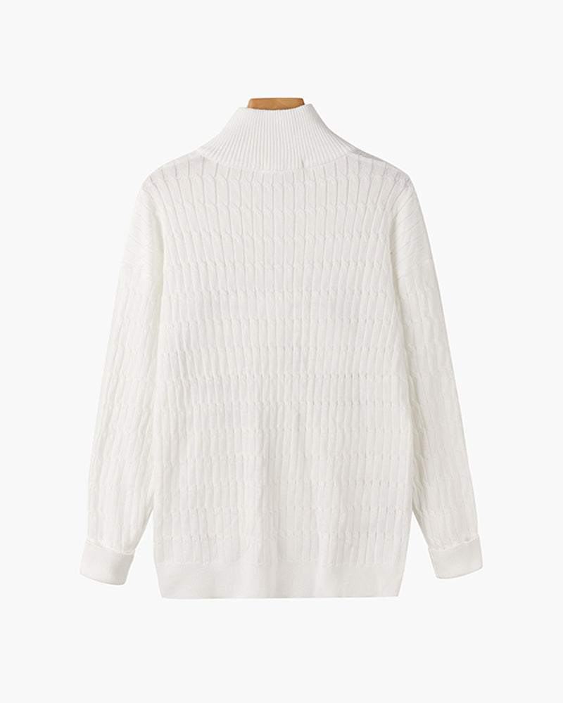Half zip ribbed sweater in cream and black with crew neckline and long sleeves