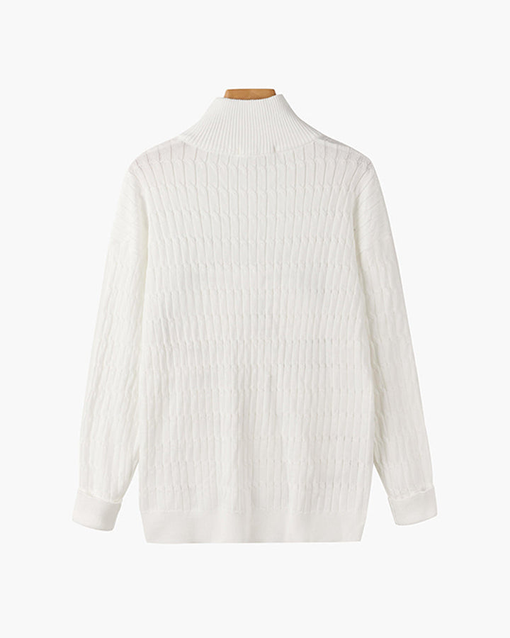 Half zip ribbed sweater in cream and black with crew neckline and long sleeves