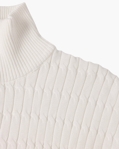 Half zip ribbed sweater in cream and black with crew neckline and long sleeves