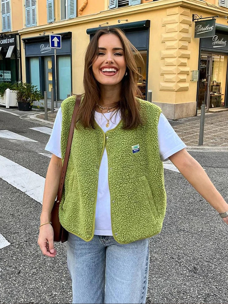 Women's textured sherpa vest with snap buttons and contrast edging