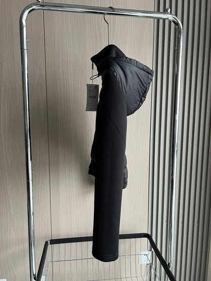 Women's black cropped hooded puffer jacket with long sleeves and front zip
