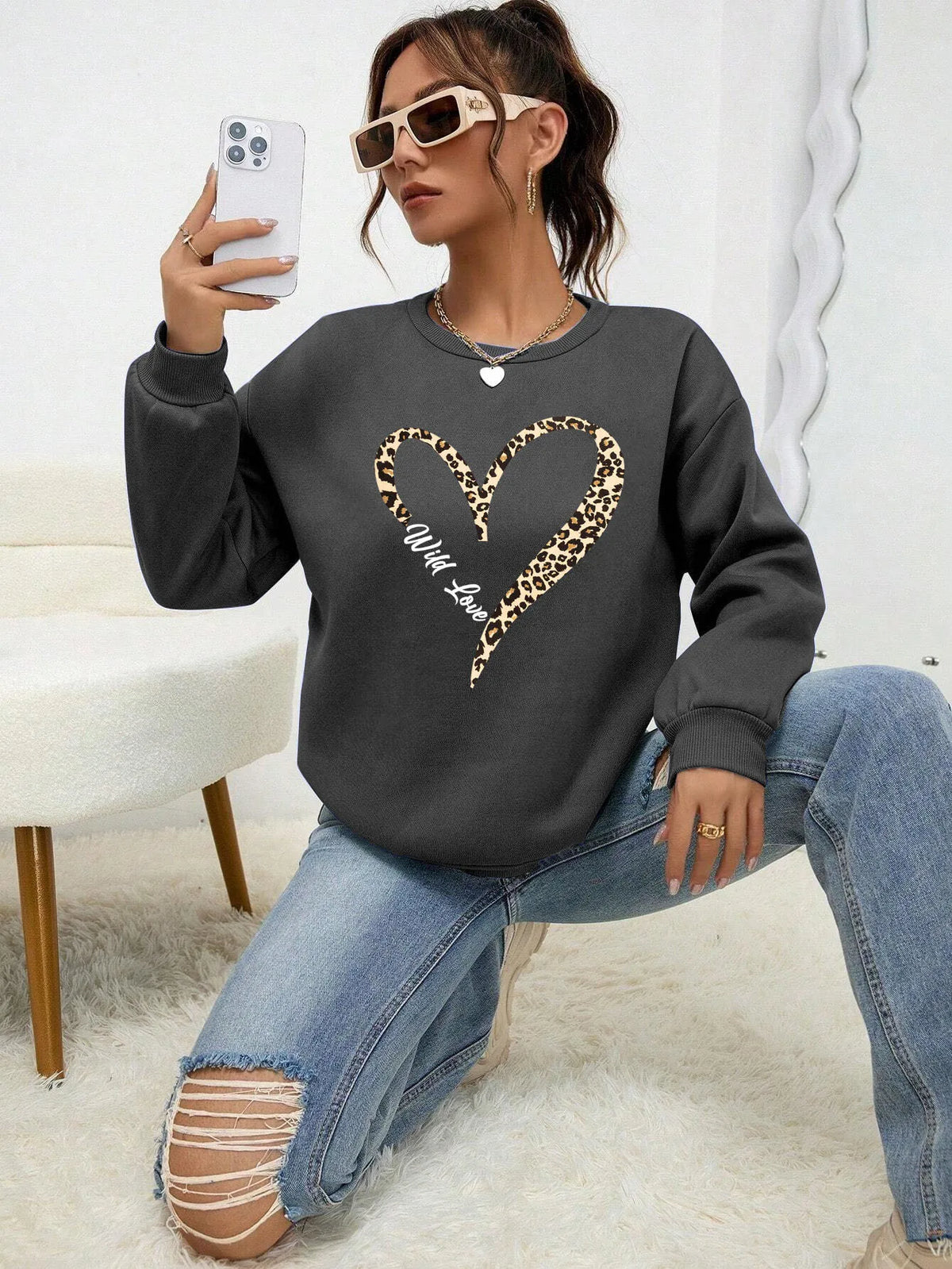 Women's sweatshirt with leopard-print heart graphic, crew neckline and long sleeves