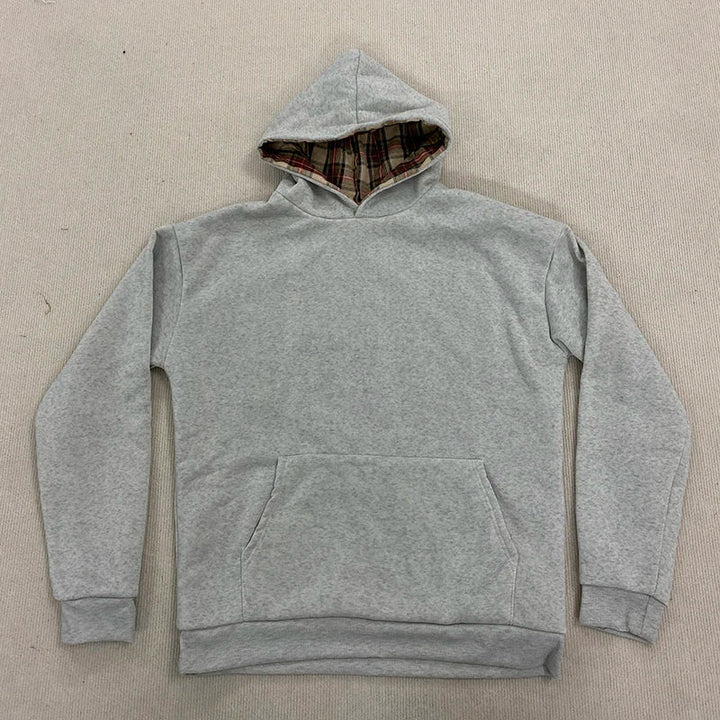 Loose hooded sweatshirt with plaid lining and kangaroo pocket