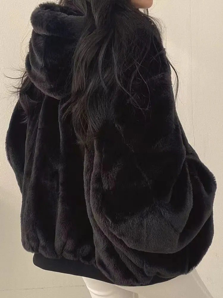 Women's lined bomber-style winter jacket with plush collar and zip front