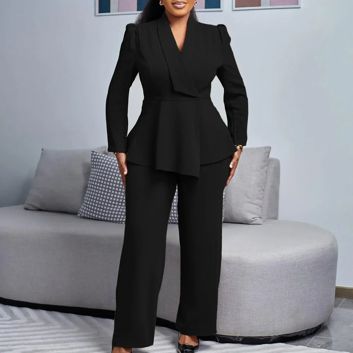 Woman wearing a beige peplum blazer suit set with wide-leg trousers