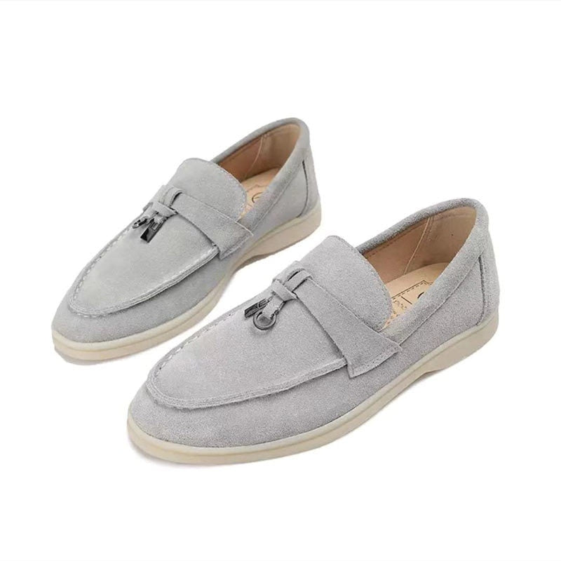 Women's flat slip-on loafers with rounded moc toe and metal trim