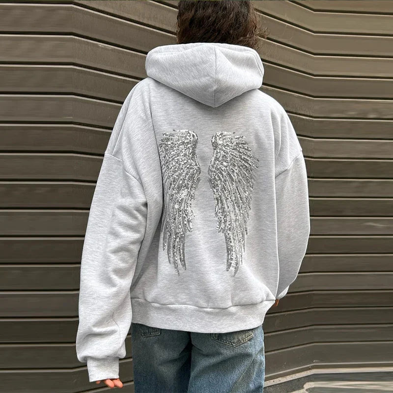Women's gray hoodie with drawstring hood and silver sequin wings on the back