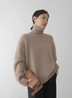 Women's relaxed turtleneck sweater with long sleeves and ribbed trims