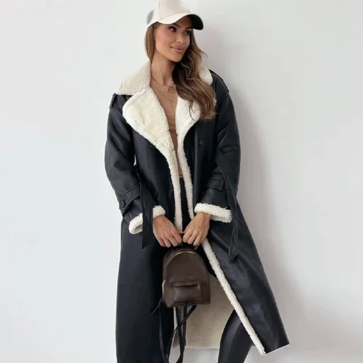 Women's long coat with contrasting shearling-style trim, lapel collar and double-breasted buttons