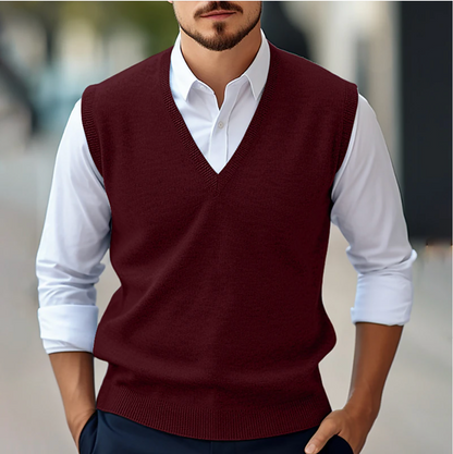 Men's sleeveless V-neck sweater vest with ribbed trims layered over a white shirt