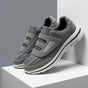 Women's wide toe slip-on sneakers with hook-and-loop straps and layered soles