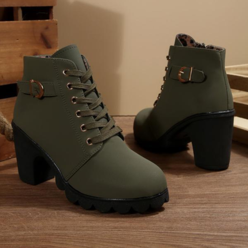 Women's black lace-up ankle boots with metal buckle detail and chunky sole