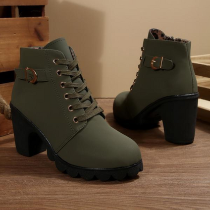 Women's black lace-up ankle boots with metal buckle detail and chunky sole