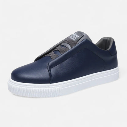 Men's low-top slip-on sneakers with stitched panels and flat white soles