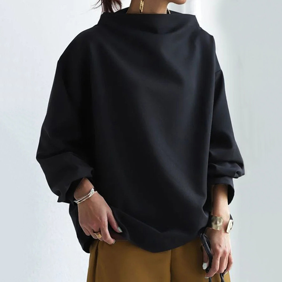 Women's black oversized mock neck sweater with long sleeves