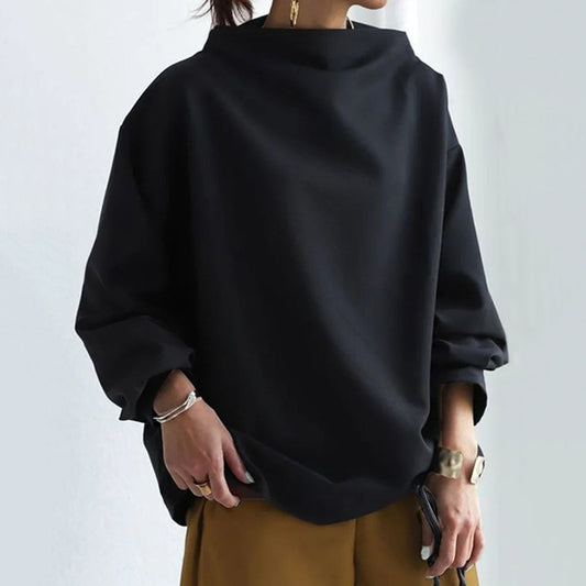 Women's black oversized mock neck sweater with long sleeves