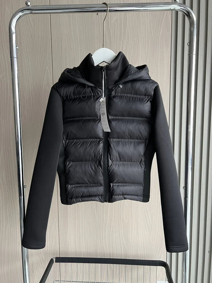 Women's black cropped hooded puffer jacket with long sleeves and front zip