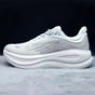 Low-top lace-up running sneaker with thick cushioned sole