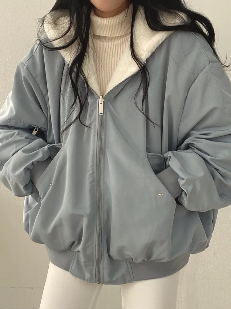 Women's lined bomber-style winter jacket with plush collar and zip front