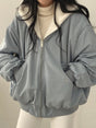 Women's lined bomber-style winter jacket with plush collar and zip front