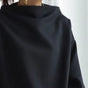 Women's black oversized mock neck sweater with long sleeves