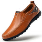 Men's slip-on loafers with moc-toe stitching and textured flat soles