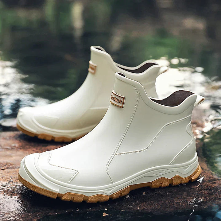Terrain ankle boots with round toes, pull tabs and lugged soles