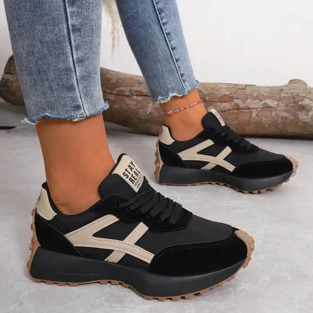 Women's panelled lace-up sneakers with rounded toes and treaded soles