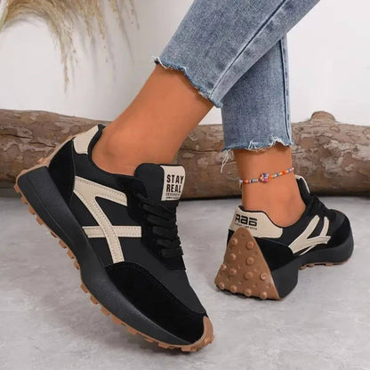 Women's panelled lace-up sneakers with rounded toes and treaded soles