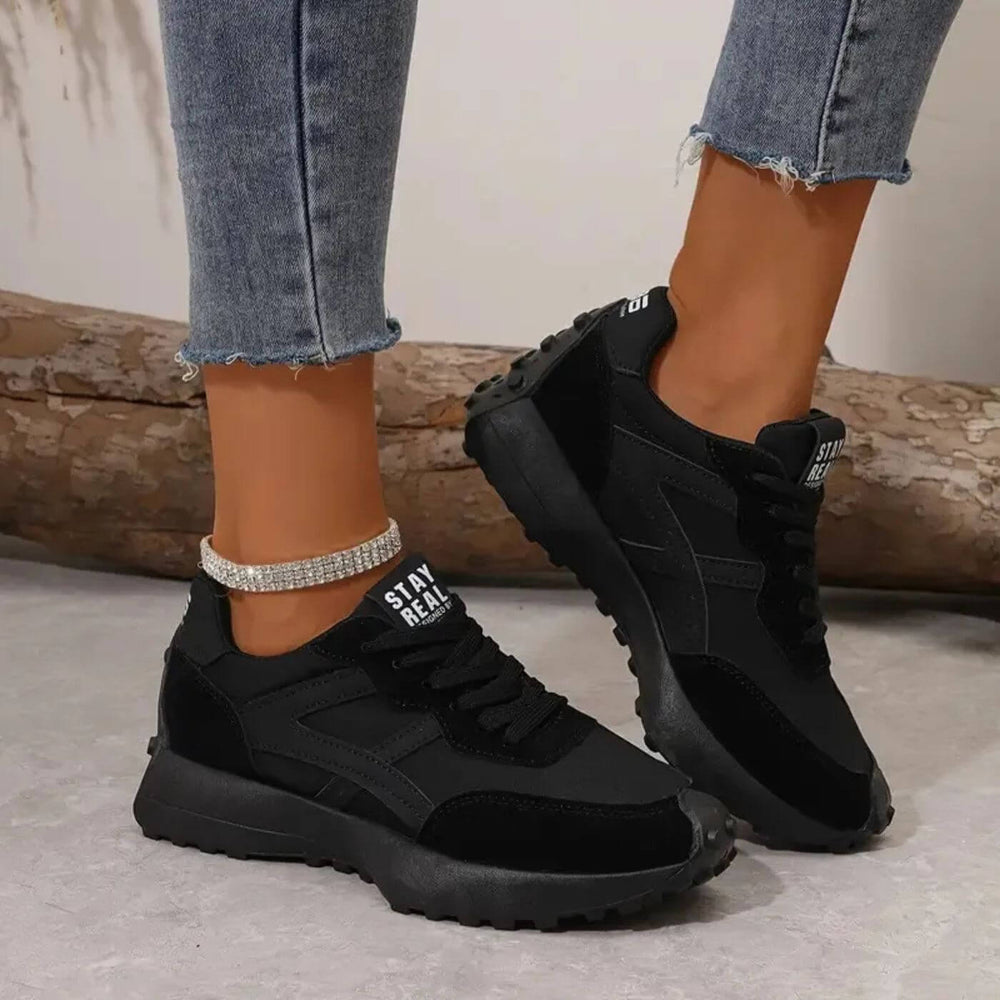 Women's panelled lace-up sneakers with rounded toes and treaded soles