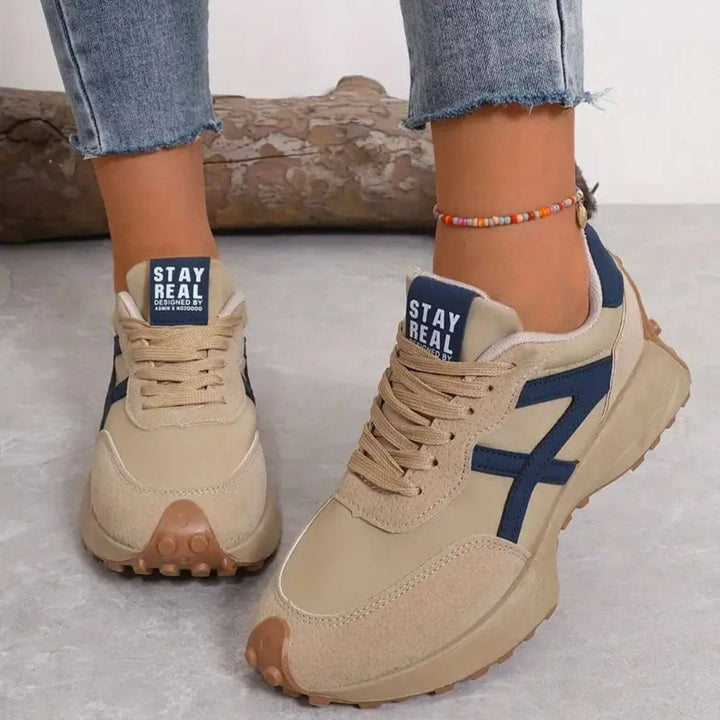 Women's panelled lace-up sneakers with rounded toes and treaded soles