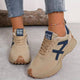 Women's panelled lace-up sneakers with rounded toes and treaded soles