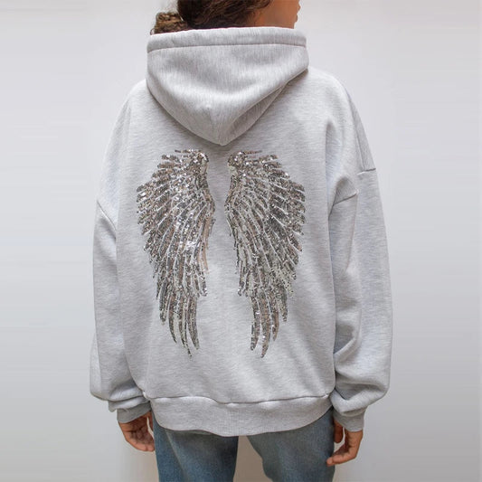 Women's gray hoodie with drawstring hood and silver sequin wings on the back