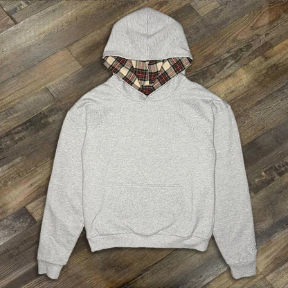 Loose hooded sweatshirt with plaid lining and kangaroo pocket