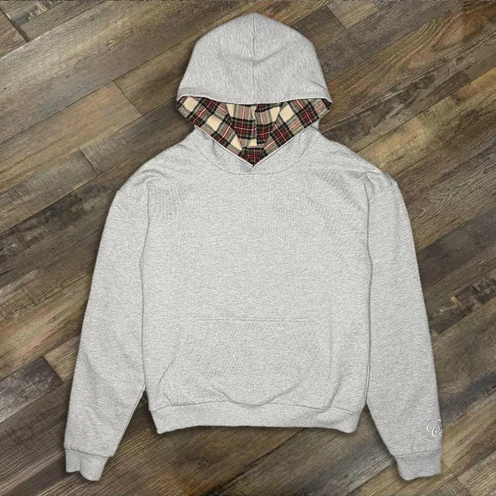 Loose hooded sweatshirt with plaid lining and kangaroo pocket
